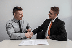 DevOps CEO Shaking Hands with Client
